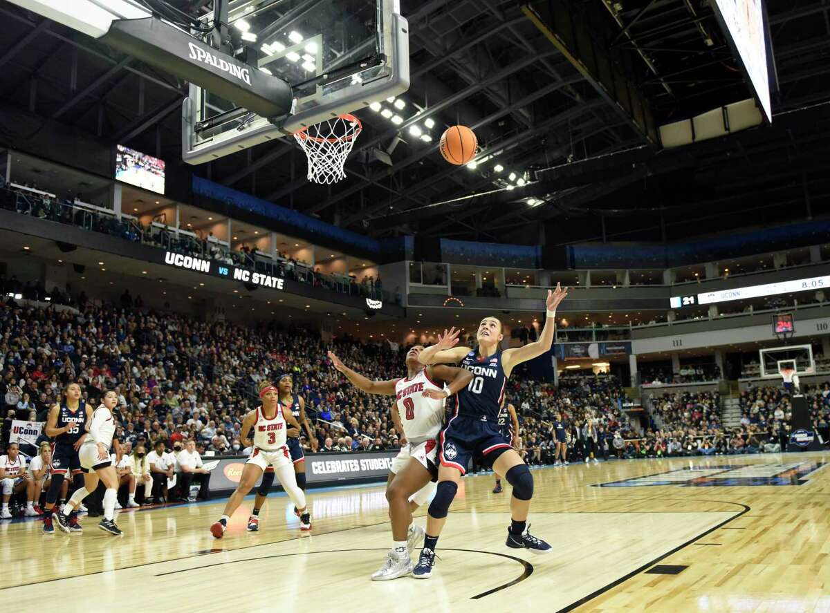 Photos from No. 2 UConn's 91-87 double overtime win against No. 1 NC State in the NCAA women's basketball tournament Elite Eight matchup at Total Mortgage Arena in Bridgeport, Conn. Monday, March 28, 2022.