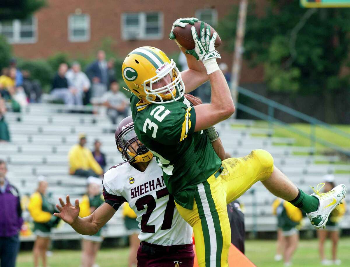 Trinity Catholic's Thomas Costigan makes a catch and comes down in the endzone for a touchdown during Saturday's football game against Sheehan at Trinity Catholic High School in Stamford, Conn., on September 13, 2014.