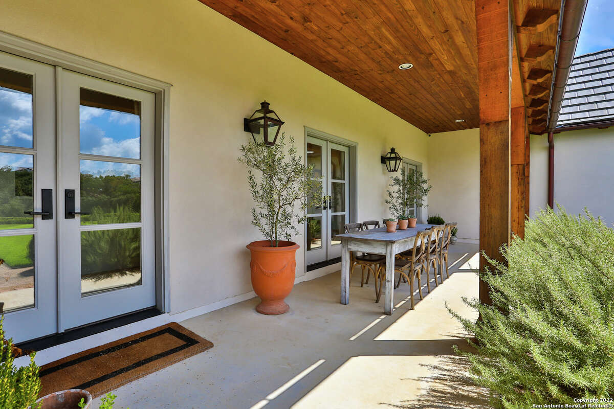 The 3,607-square-foot Boerne home with a stone chimney and walls surrounding the front side and side courtyard sits on 1.2 acres just southwest of downtown Boerne.