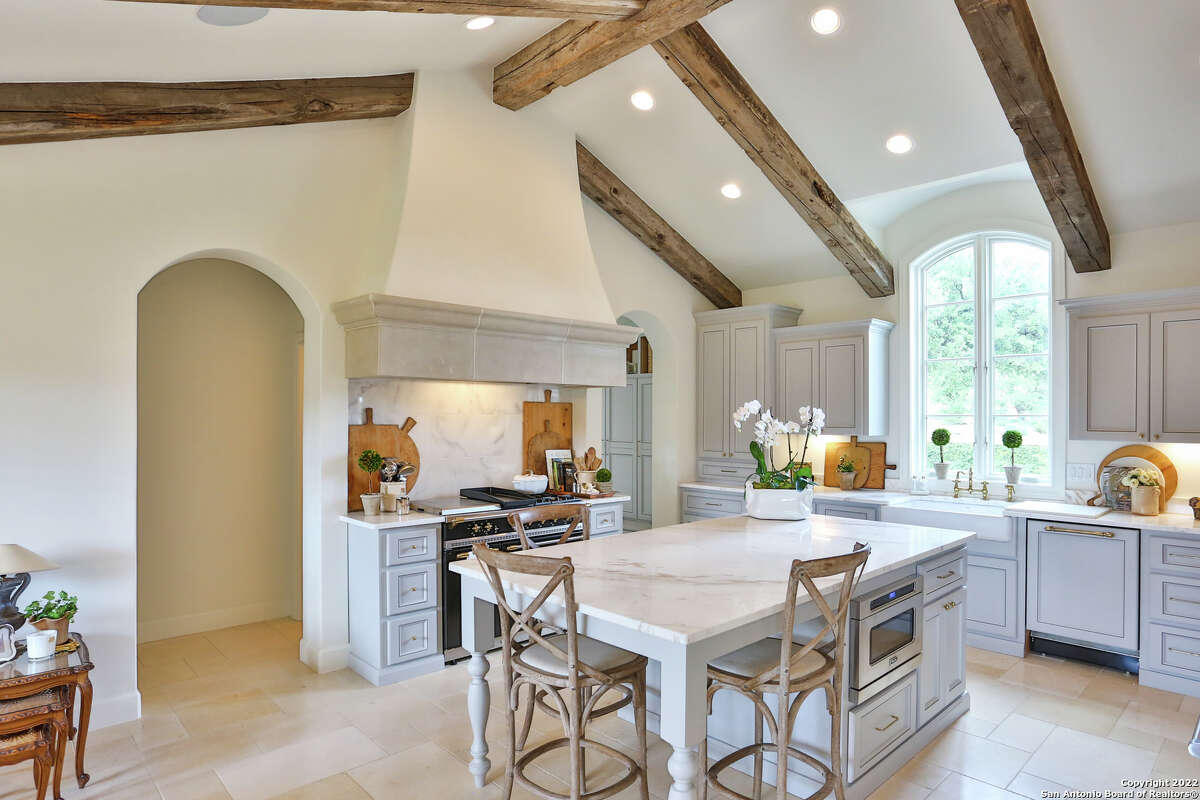 The 3,607-square-foot Boerne home with a stone chimney and walls surrounding the front side and side courtyard sits on 1.2 acres just southwest of downtown Boerne.