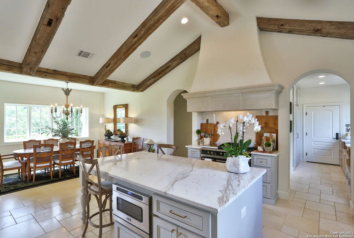 The 3,607-square-foot Boerne home with a stone chimney and walls surrounding the front side and side courtyard sits on 1.2 acres just southwest of downtown Boerne.
