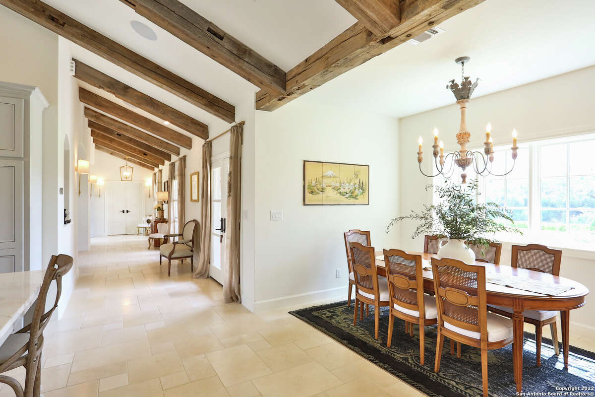 The 3,607-square-foot Boerne home with a stone chimney and walls surrounding the front side and side courtyard sits on 1.2 acres just southwest of downtown Boerne.