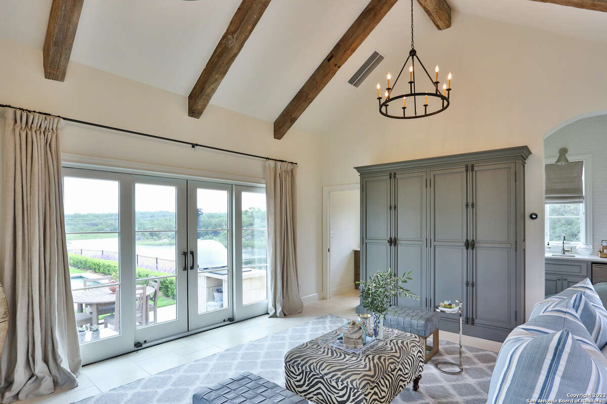 The 3,607-square-foot Boerne home with a stone chimney and walls surrounding the front side and side courtyard sits on 1.2 acres just southwest of downtown Boerne.