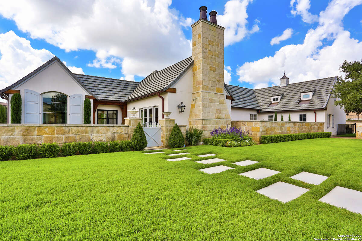 The 3,607-square-foot Boerne home with a stone chimney and walls surrounding the front side and side courtyard sits on 1.2 acres just southwest of downtown Boerne. 