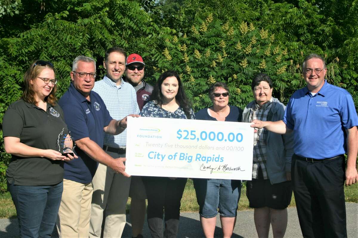 Members of the big Rapids parks and Recreation board, along with city officials were presented with a $25,000 check from Consumers Energy's "Put Your Town on the Map" contest. Funds will support construction of a skate Park at Swede Hill Park. Pictured, from left, are: Paula Priebe, community development director; Big Rapids Mayor, Fred Guenther; city manager Mark Gifford; Parks and Rec coordinator Josh Pyles; planning and zoning technician, Emily Szymanski; parks and rec board members,  Deb Chipman and Margaret Maynard; and Consumers Energy community affairs manager, Patrick Tiedt.