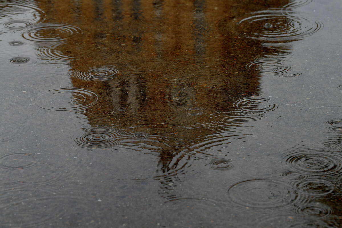 The Jefferson County courthouse is reflected in a puddle as morning showers persist Thursday. Rain is forecast possibly through the weekend, bringing some much-needed moisture to the recent drought conditions. Photo made Thursday, June 30, 2022. Kim Brent/The Enterprise