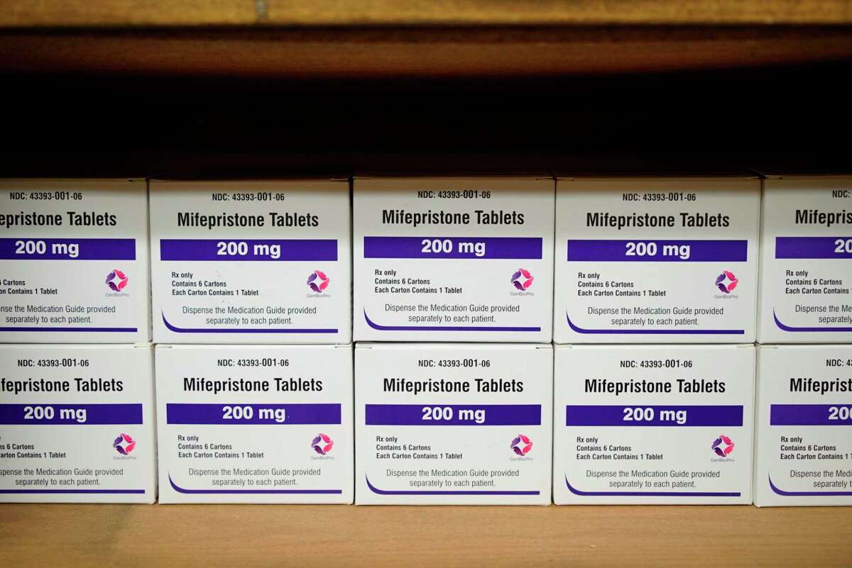 FILE - Boxes of the drug mifepristone line a shelf at the West Alabama Women's Center in Tuscaloosa, Ala., on Wednesday, March 16, 2022. Facebook and Instagram have begun promptly removing posts that offer abortion pills to women who may not be able to access them following a Supreme Court decision that stripped away constitutional protections for the procedure. (AP Photo/Allen G. Breed, File)