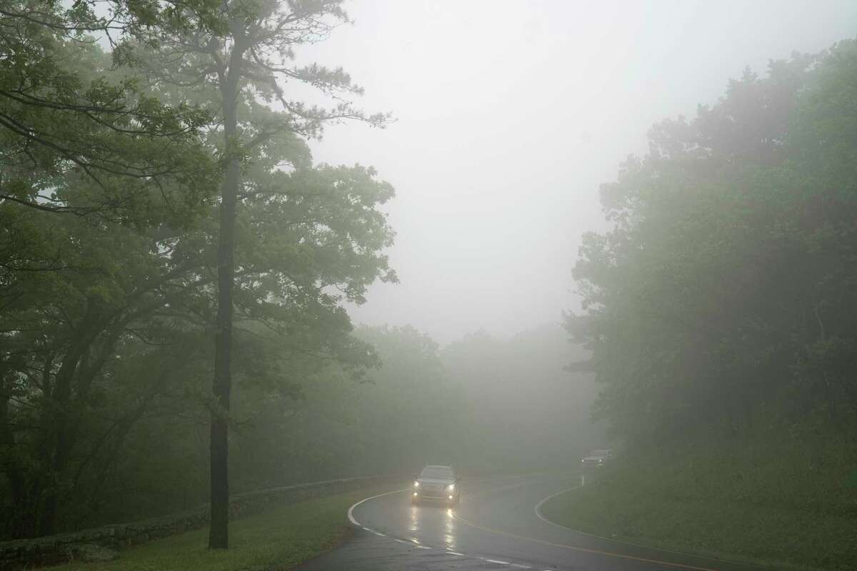 A car drives through Shenandoah National Park in Virginia near Pinnacles Overlook on June 7, 2022. In April 2021, Ty Sauer, 18, ran into the dense foliage of this mountain park. He was discovered dead days later.