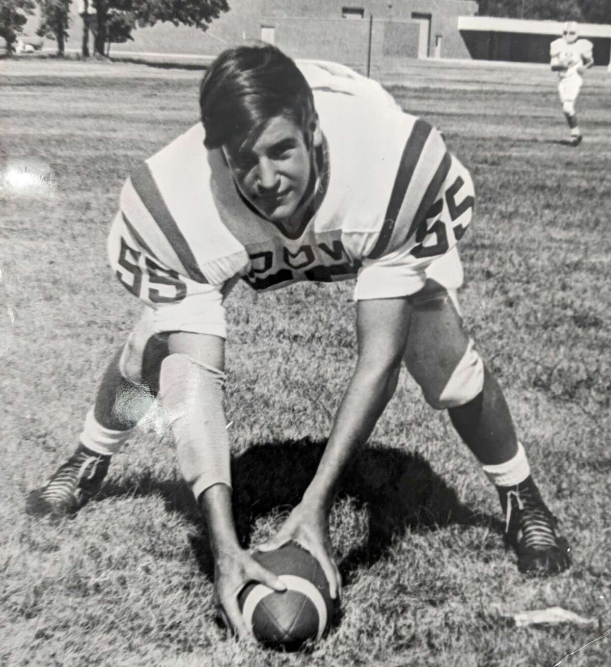 This is Mike Hoy on the football field at Dow High School around 1970. Athletic. In good health. On Senior Skip Day on May 28, 1971, Mike went waterskiing at Wixom Lake with friends. A week later, he would have his graduation ceremony, and that fall he planned to attend Northern Michigan University.