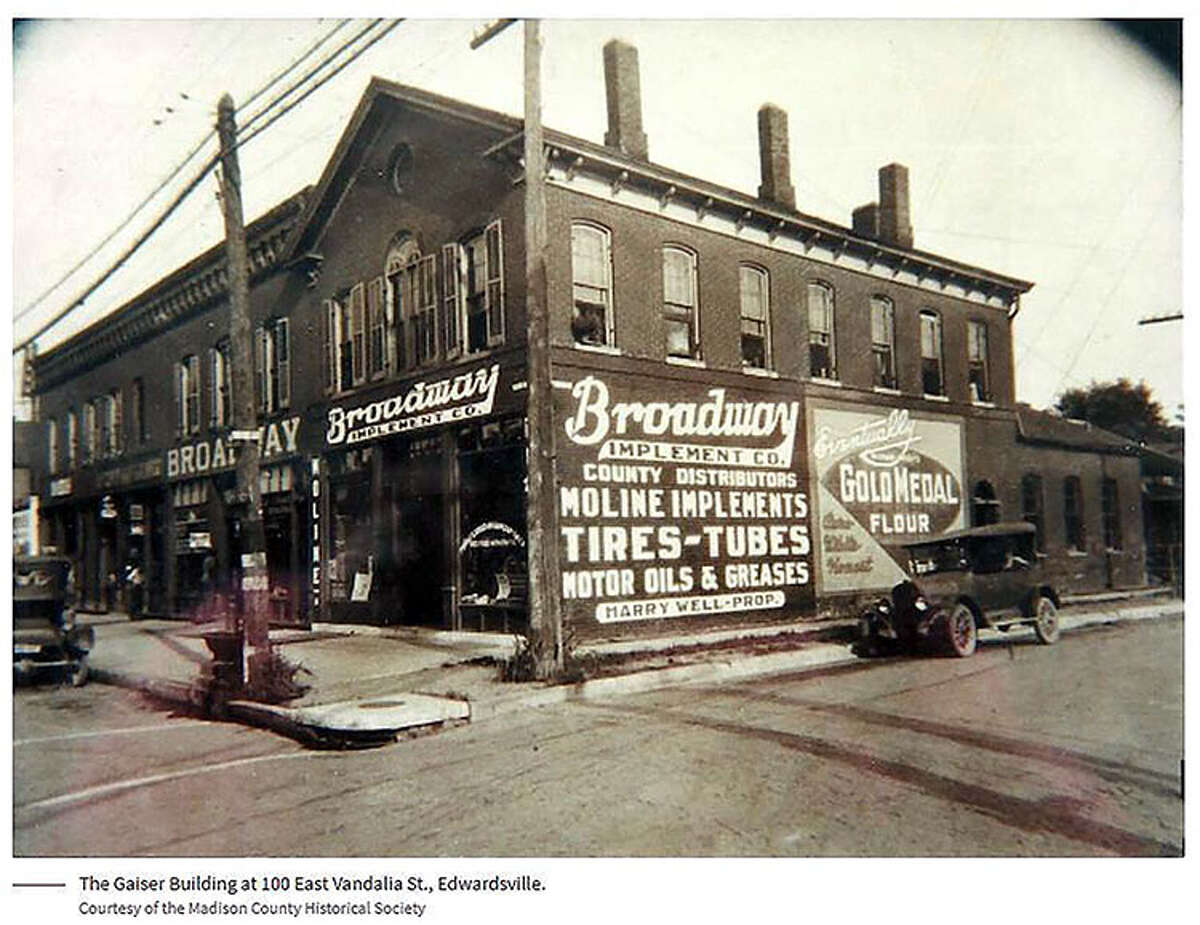 A look at 100 East Vandalia Street during the 1920s, when it was known as the Gaiser Building. Even then, the west-facing wall carried business slogans.