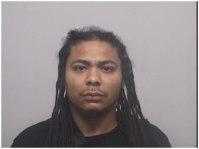 Stamford man charged after guns, drugs found in abandoned cars