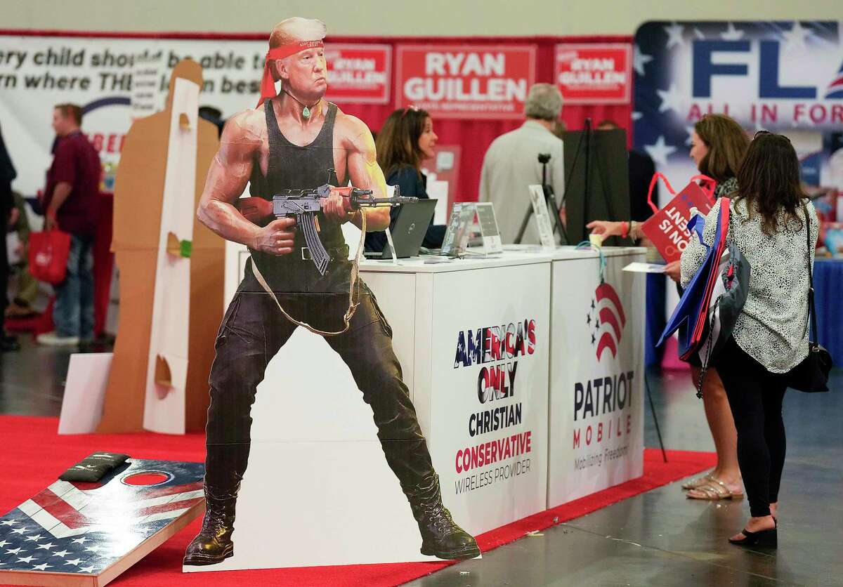 A Donald Trump cutout stands at Patriot Mobile display at the Republican Party of Texas convention at George R. Brown Convention Center on Thursday, June 16, 2022, in Houston. (Elizabeth Conley/Houston Chronicle via AP)