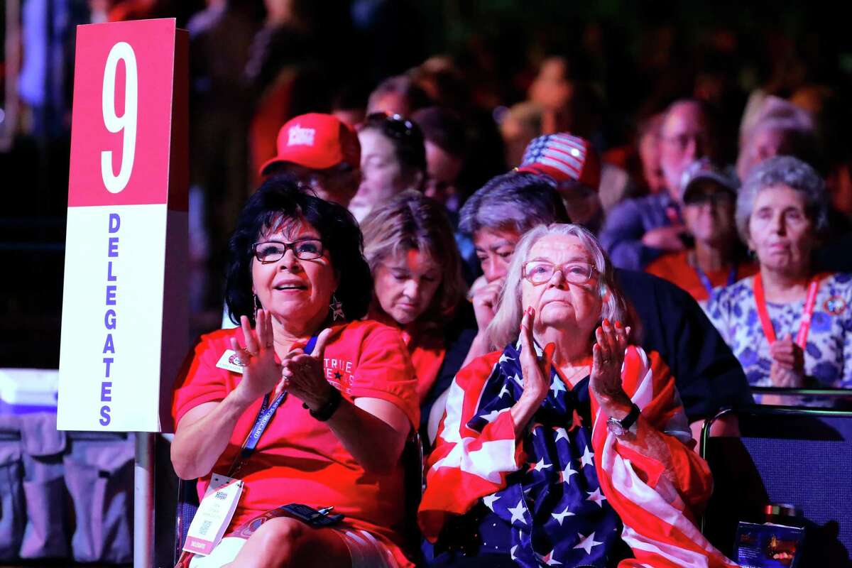 Senate District 9 delegates Carla Gonzales, left, and Lois Kapp, right, applaud speakers during the third and final day of this year’s Republican Party of Texas Convention Saturday, June 18, 2022, held at the George R. Brown Convention Center in Houston, TX.