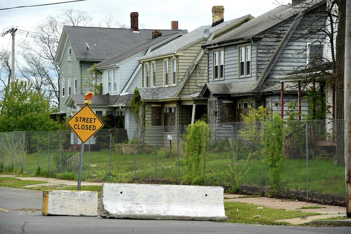 Homes await demolition for The Haven project on a closed section of Main Street in West Haven on May 10, 2021.