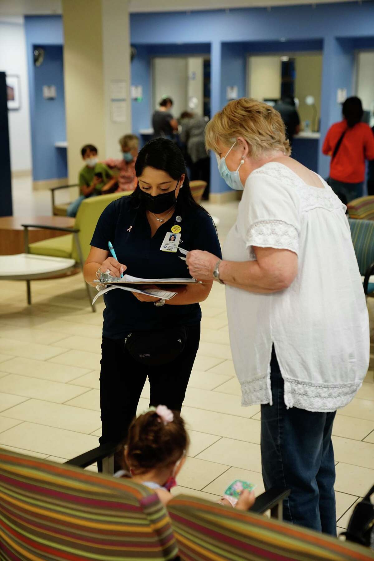 Sarah Trejo of University Health gets patient information during a vaccination clinic on Thursday sponsored by University Health at its Robert B. Green campus downtown.