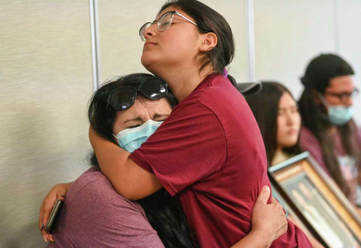 Velma Lisa Duran, left, sister of Irma Garcia, one of two teachers killed along with 19 students at Robb Elementary School in Uvalde on May 24, is comforted at a City Council meeting on Thursday in which residents slammed the lack of information provided to families of the victims.