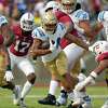 STANFORD, CALIFORNIA - SEPTEMBER 25: Zach Charbonnet #24 of the UCLA Bruins carries the ball against the Stanford Cardinal during the first quarter of an NCAA football game at Stanford Stadium on September 25, 2021 in Stanford, California. (Photo by Thearon W. Henderson/Getty Images)
