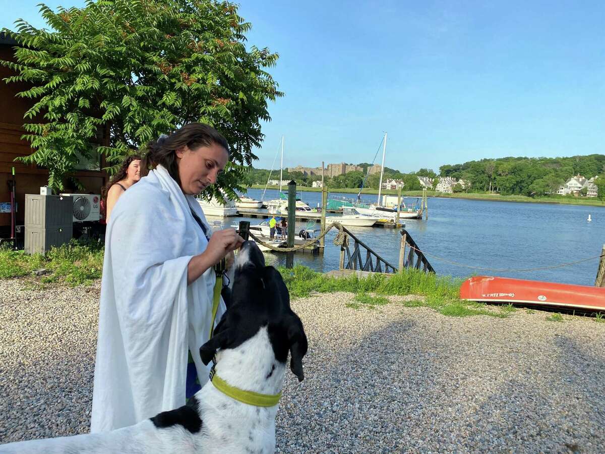 A woman with her dog. The two were on a plane that crashed in the Quinnipiac River in New Haven Thursday evening.
