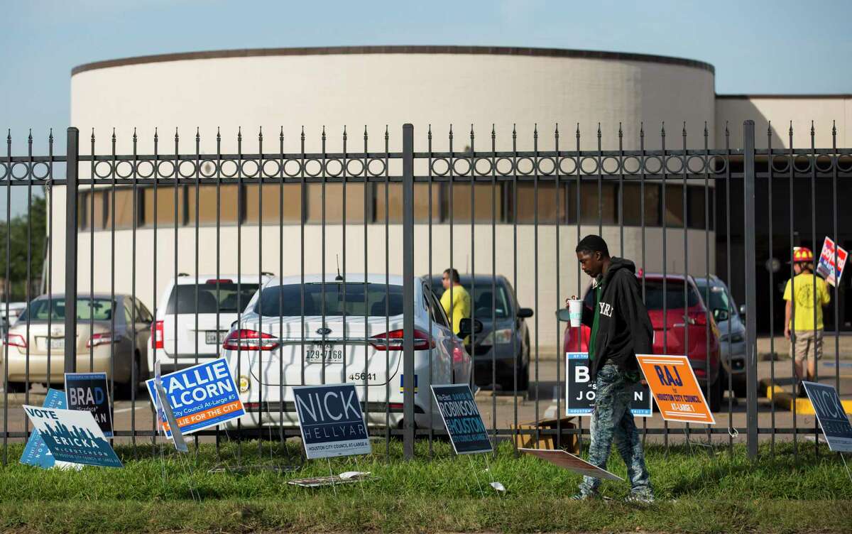 Election campaign signs are placed outside the Sunnyside Multi Service Center on Tuesday, Nov. 5, 2019, in Houston.