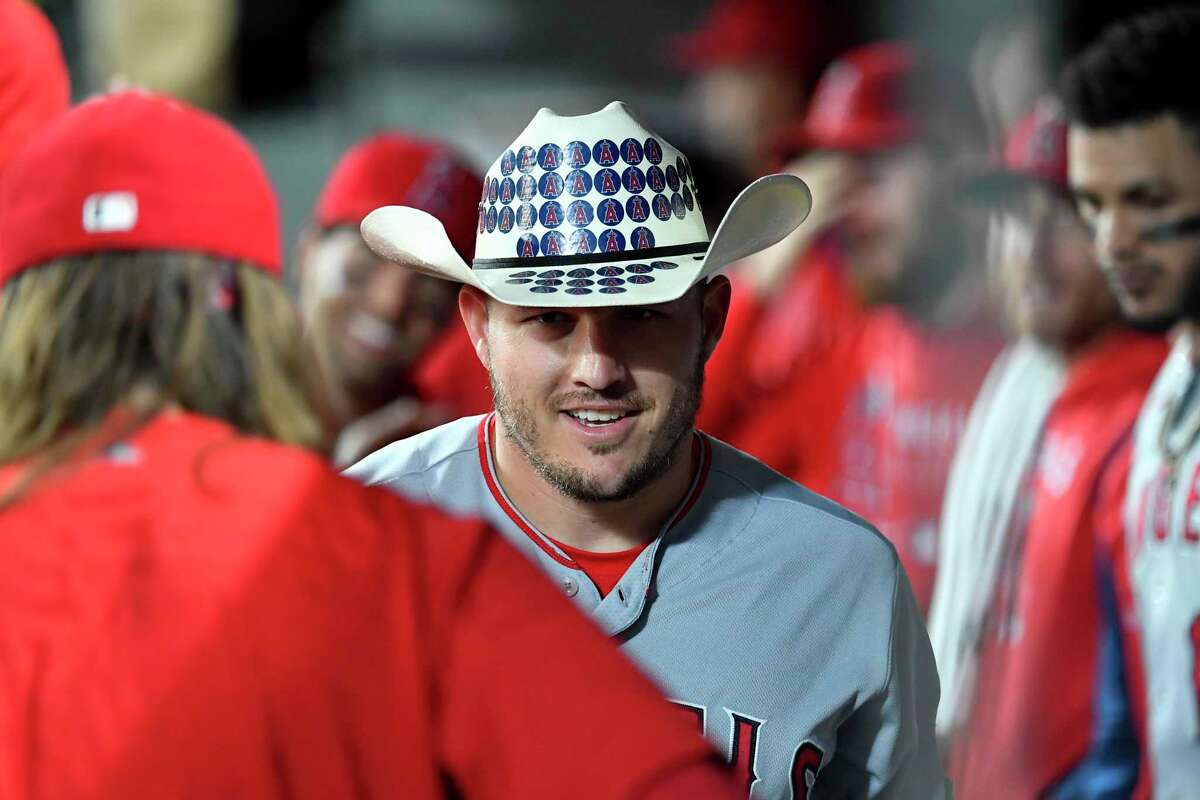 Mike Trout sports a cowboy hat that the Angels, in tribute to former owner Gene Autry, plant on each other after home runs. Trout has 23 long balls to his credit this season.