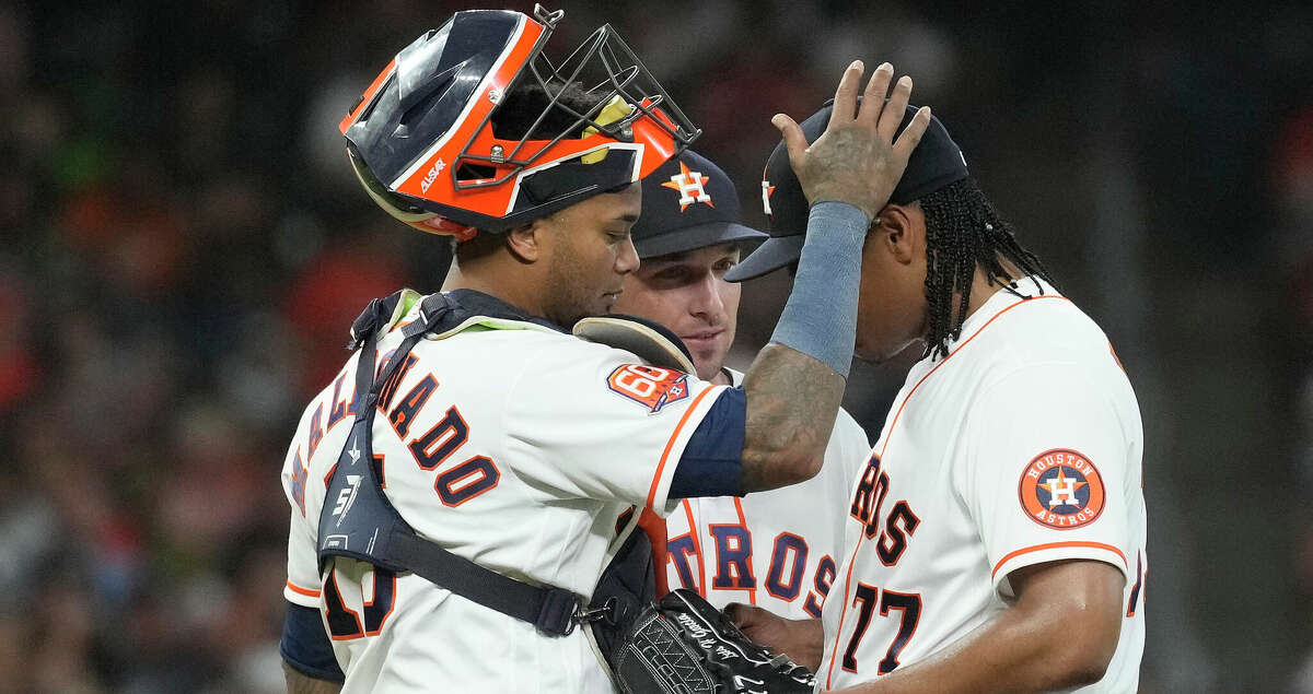 Houston Astros starting pitcher Luis Garcia (77) gets a pat on the head from catcher Martin Maldonado (15) as manager Dusty Baker Jr. (12) walks out to pull him after he gave up a home run to New York Yankees Anthony Rizzo during the sixth inning of an MLB game at Minute Maid Park on Thursday, June 30, 2022 in Houston.