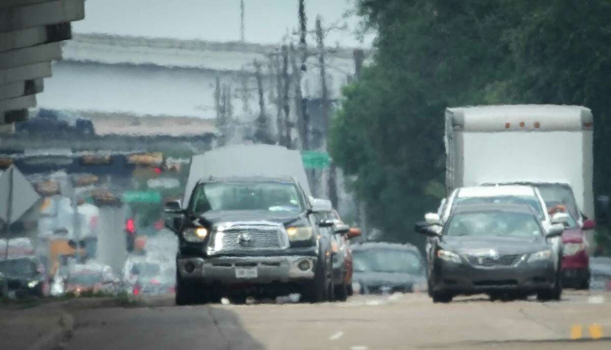 Traffic moves down Westpark Drive near the intersection with Chimney Rock Road on Wednesday, June 29, 2022, in Houston.
