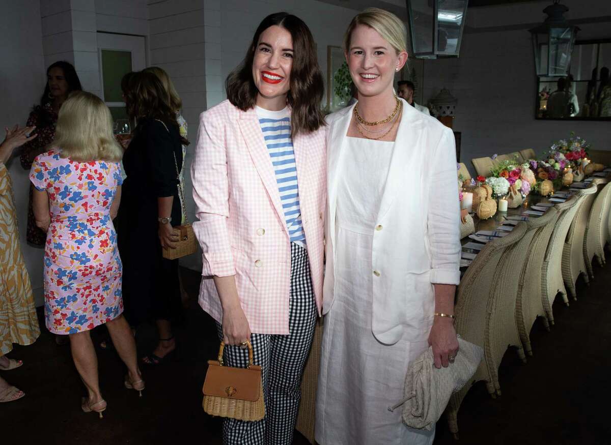 Valerie Dittner, left, and Devon Liedtke pose for a photograph before the dinner party celebrating the 45th anniversary of J. McLaughlin clothing company Wednesday, June 22, 2022, at Tiny's No. 5 in Houston.