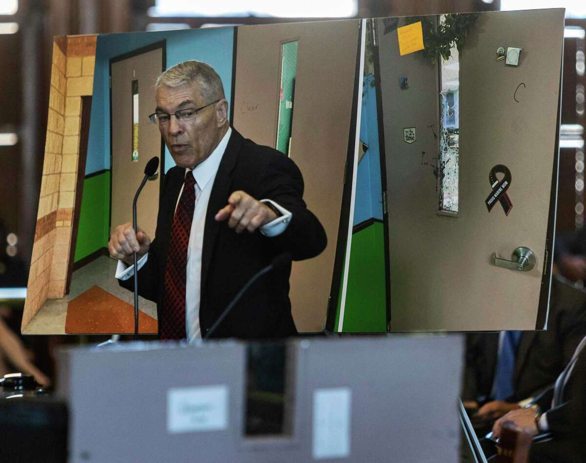Texas Department of Public Safety director Steve McCraw testifies while standing in front of an image of the doors in Robb Elementary, where 19 children and two adults were killed by an 18-year-old with an AR 15-style assault rifle. Texas spends less than $10 per child on campus safety. A costly and inconvenient investment is needed for school safety, San Antonio Police Chief William McManus says.