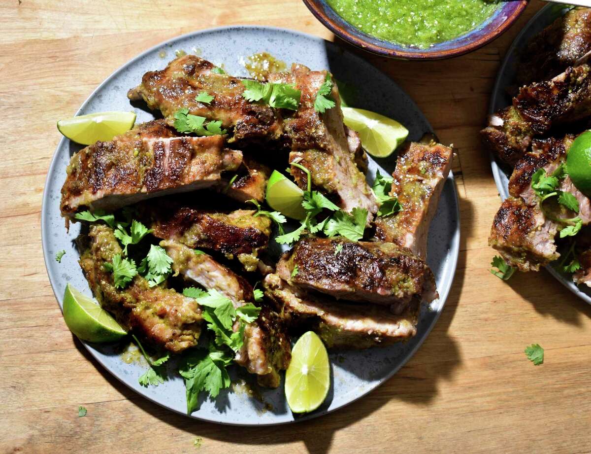 Pork ribs are slathered in fresh salsa verde made with tomatillos and broiled or baked until a golden crust encases the succulent meat.