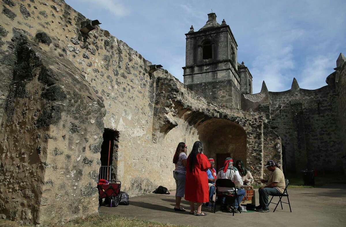 Members of the Tehuan Band of Mission Indians of San Antonio play a traditional drum chorus at Mission Concepción on Sept. 4, 2019.