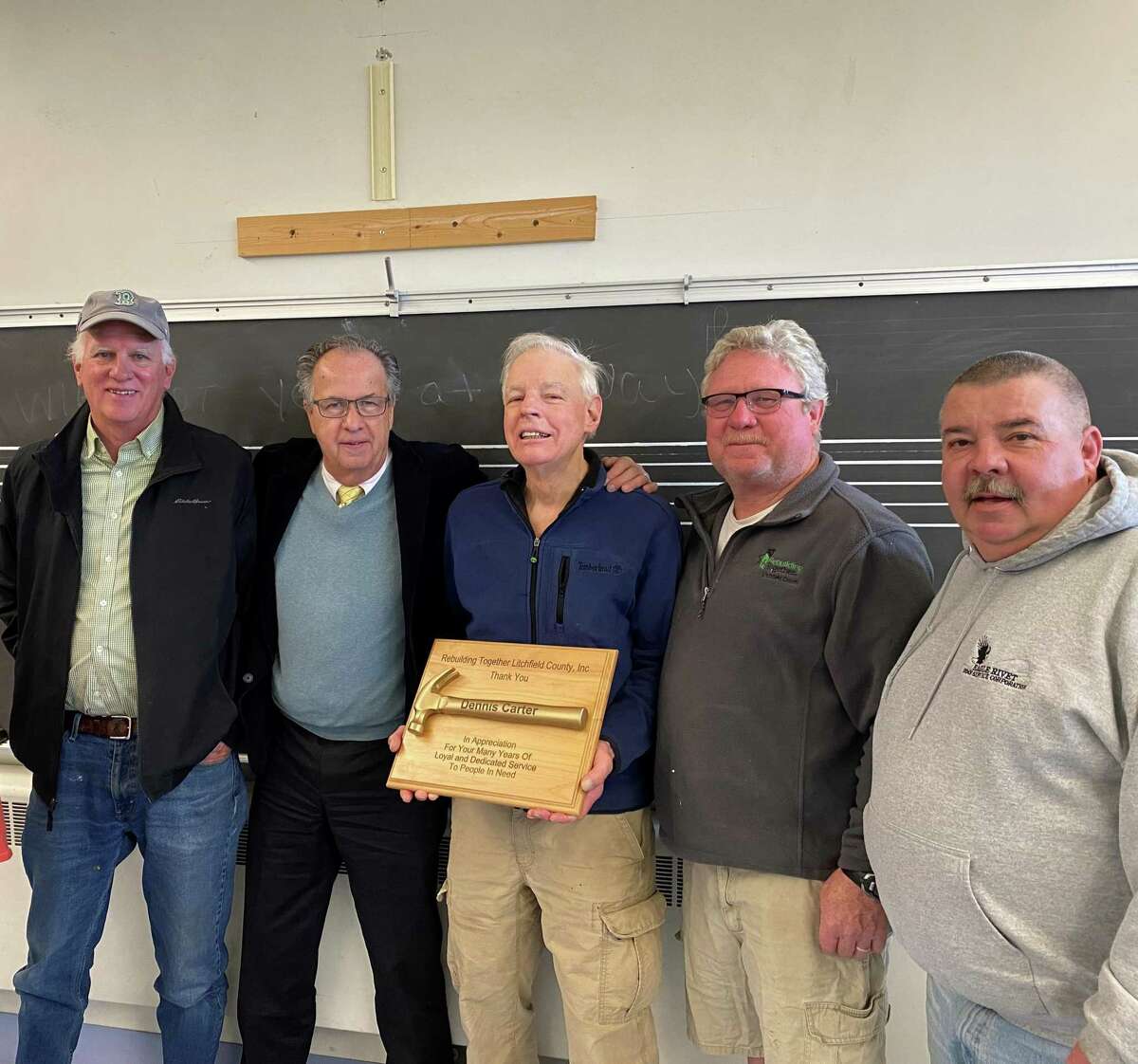 Board members, left to right, Bruce Adams, John Matta, Dennis Carter, Mike Bogues, and Tom Voytek, gathered to honor Carter's contribution to Rebuilding Together Litchfield County during the past decade.