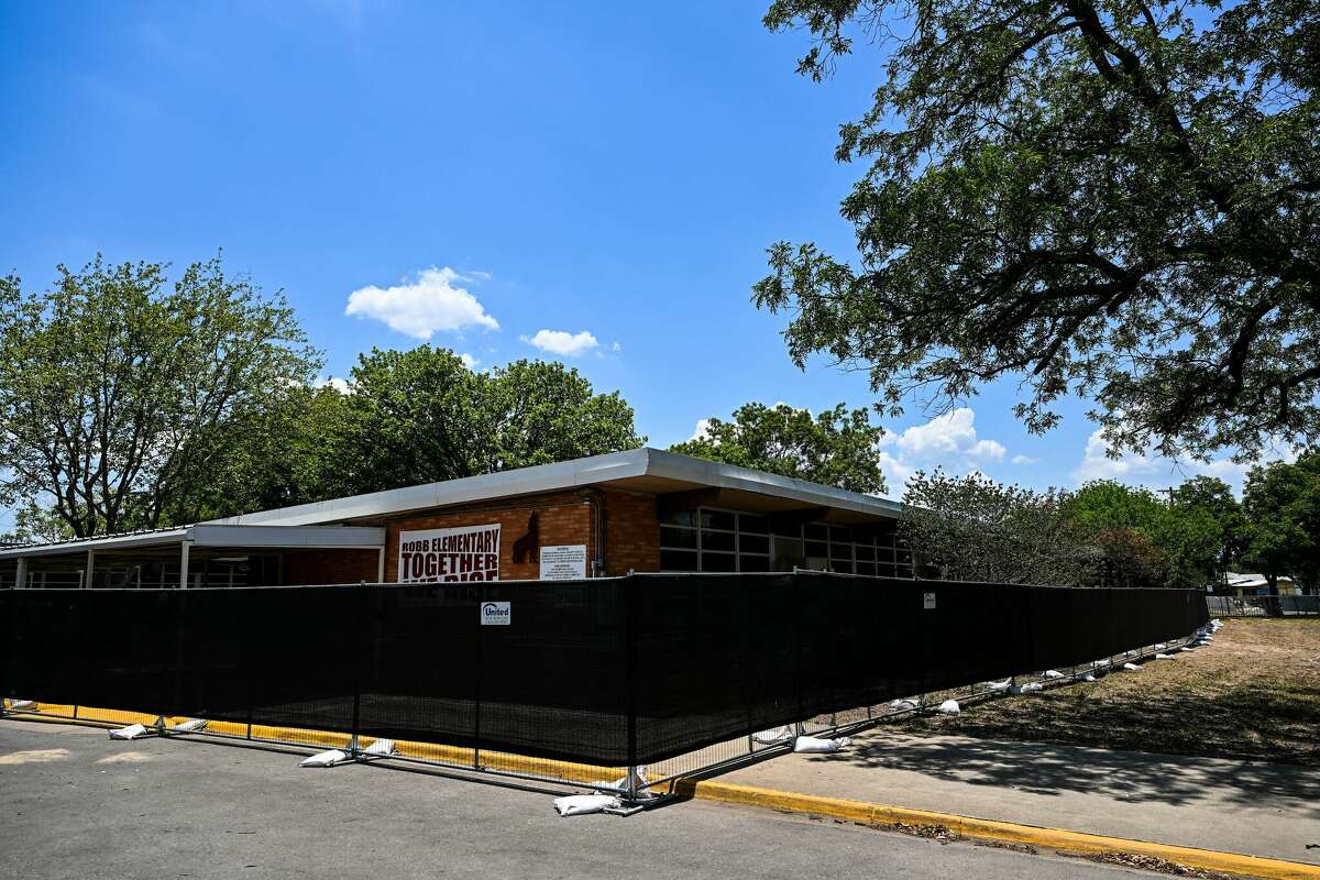 Fences are seen around Robb Elementary School in Uvalde, Texas, on June 30, 2022. Nineteen young children and two teachers were killed when a teenage gunman went on a rampage at Robb Elementary on May 24 in America's worst school shooting in a decade.