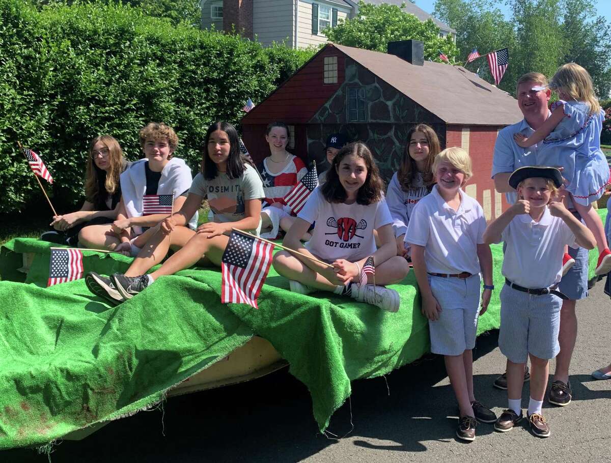 Members of the Children of the American Revolution take part in the Old Greenwich Memorial Day Parade. From left, Issy Ojjeh, Liv Zieme, Lauren Huang, Whitney Marder and Charles Pribyl; Alexander Pribyl in front; and in back from left Sophie Ojjeh and Campbell Pribyl all get a ride on the group’s float.