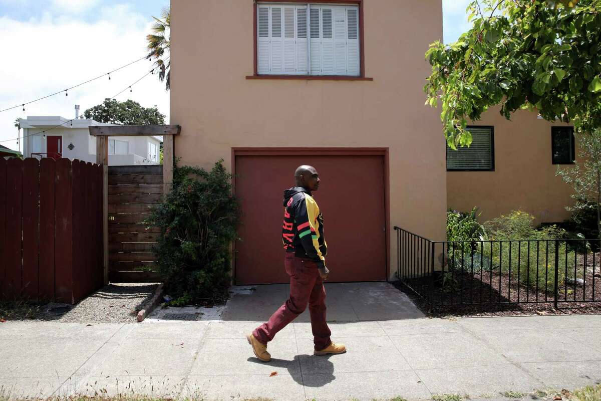 Darris Young walks along Oregon Street in Berkeley on Thursday, June 30, 2022. He and his colleagues at the Bay Area Regional Health Inequities Initiative this year backed a first-of-its-kind $ 500 million fund to narrow the region's racial housing gap. Though the measure was not included in the budget passed by lawmakers the week of June 27, Young and other advocates hope to see a version of the proposal materialize through future negotiations.