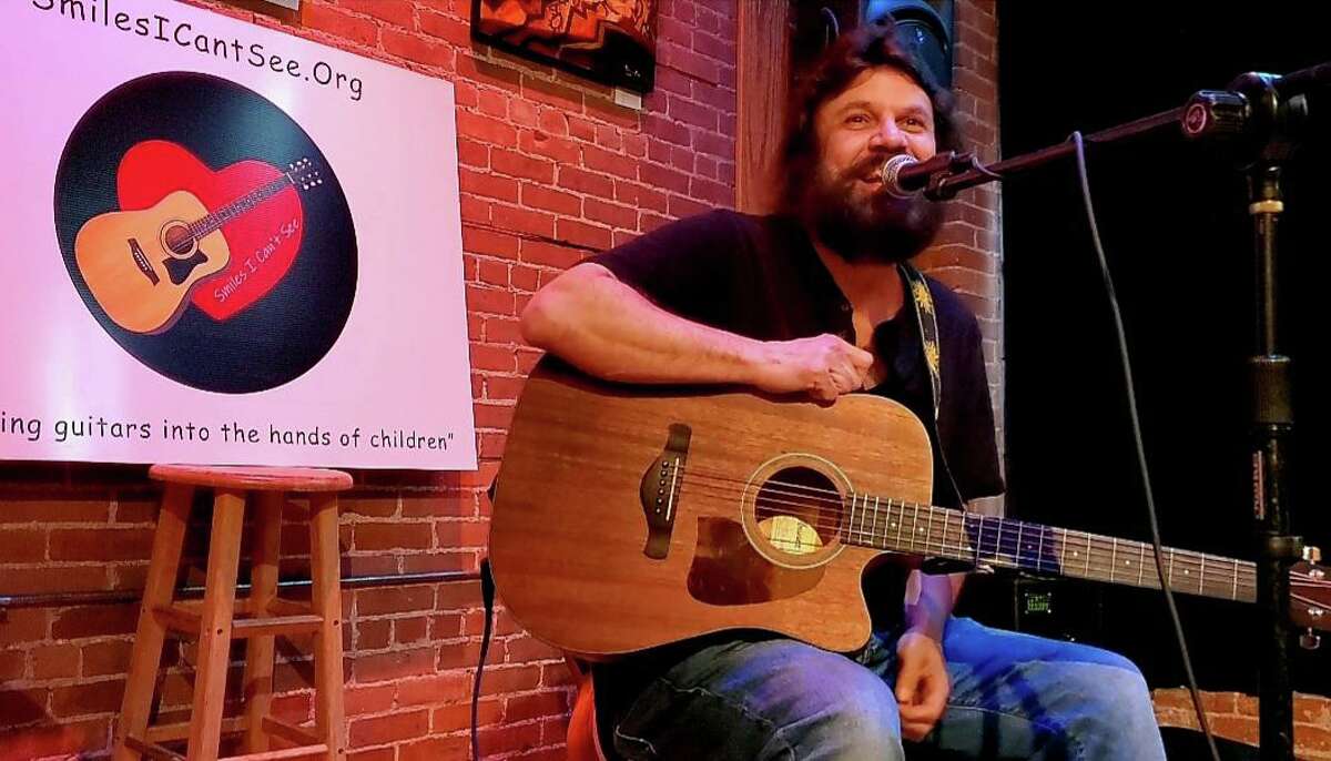 New Milford resident Vincent Rodriguez has started a nonprofit, Smiles I Can't See, that gives away guitars to children.