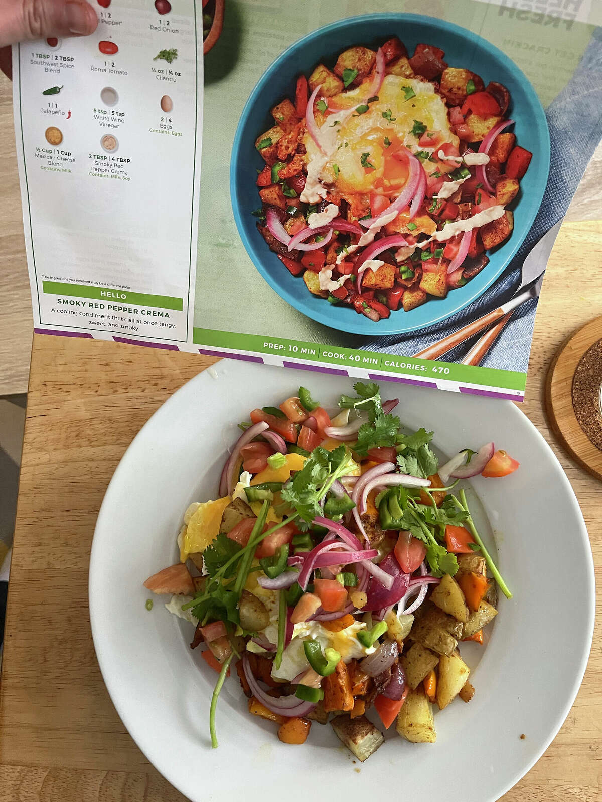 HelloFresh cheesy fried eggs over nacho potato hash.