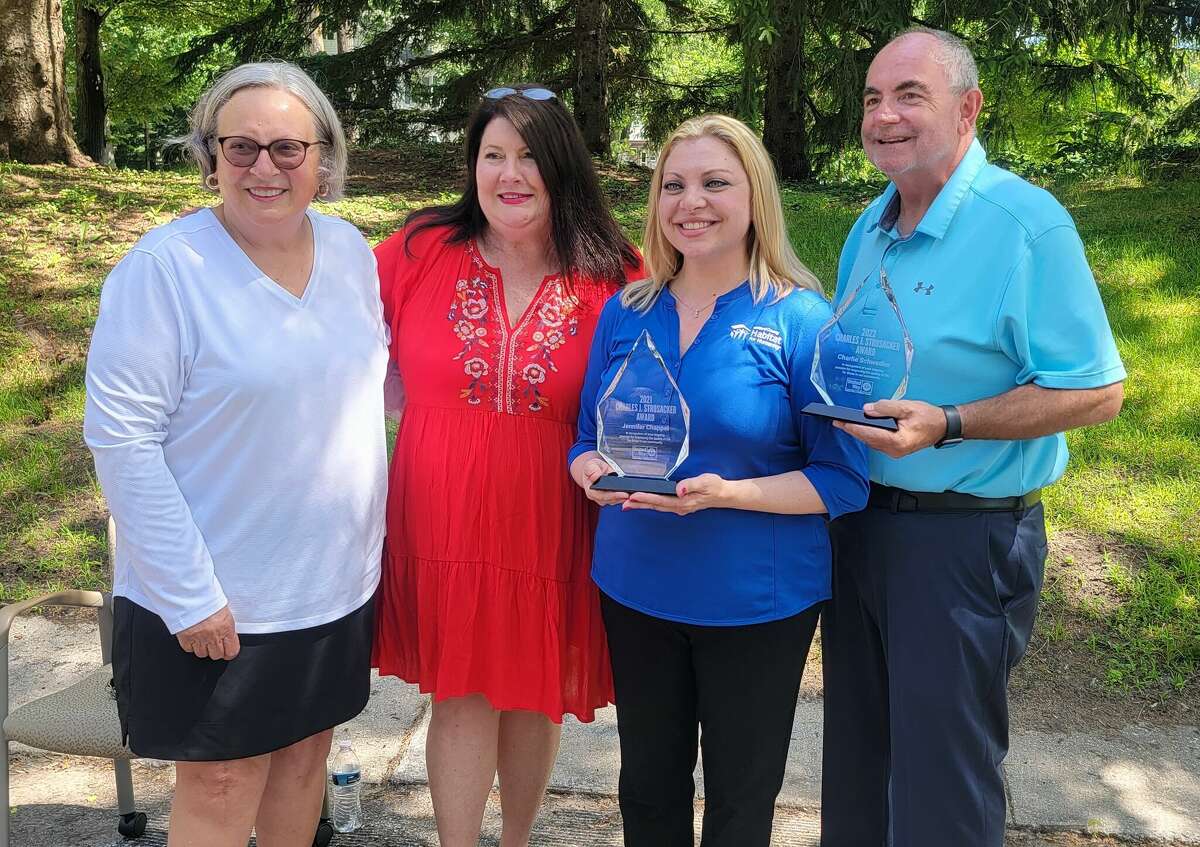 United Way of Midland County named Jennifer Chappel, second from right, and Charlie Schwedler, far right, as the honorees of the 2021 and 2022 Charles J. Strosacker Award.
