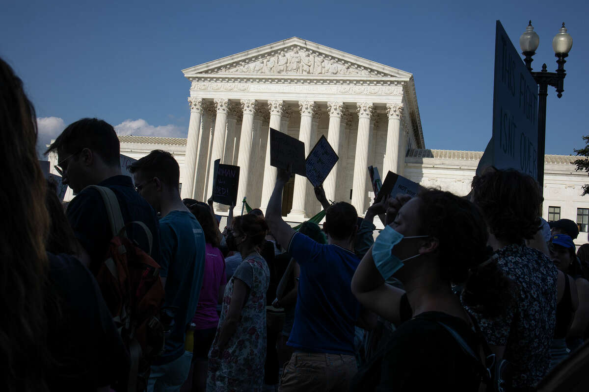 Protesters stand outside of the Supreme Court in Washington, D.C. on June 24 after the Supreme Court issued a ruling that overturned the constitutional right for women to receive an abortion in America.