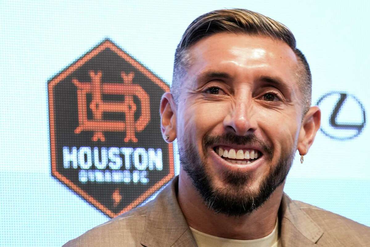 Houston Dynamo midfielder Héctor Herrera laughs during an introductory news conference Friday, July 1, 2022 in Houston. Herrera, the highest-profile international signing in Dynamo history, is a captain with the Mexican national team and comes to Houston from Atlético de Madrid in Spain.