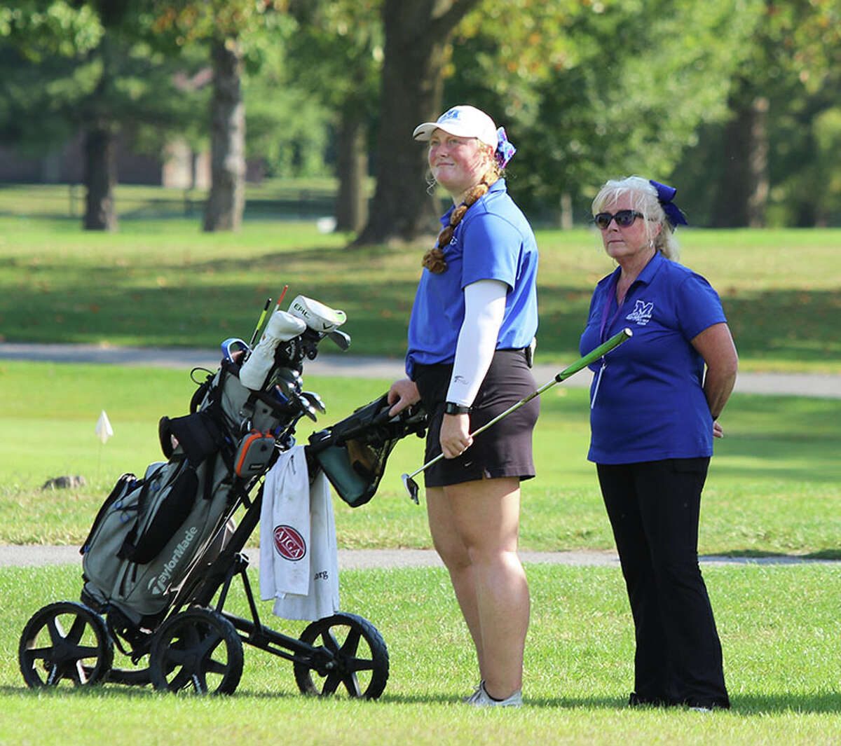 Marquette's Gracie Piar (left) and coach Deb Walsh look toward the green during Piar's round of 65 at the Class 1A regional last fall at Belk Park in Wood River. Piar is the 2021 Telegraph Girls Golfer of the Year.