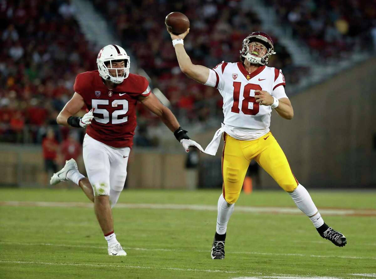 Southern California quarterback JT Daniels (18) throws a pass under pressure by Stanford linebacker Casey Toohill (52) during the second half of an NCAA college football game, Saturday, Sept. 8, 2018, in Stanford, Calif. (AP Photo/Tony Avelar)
