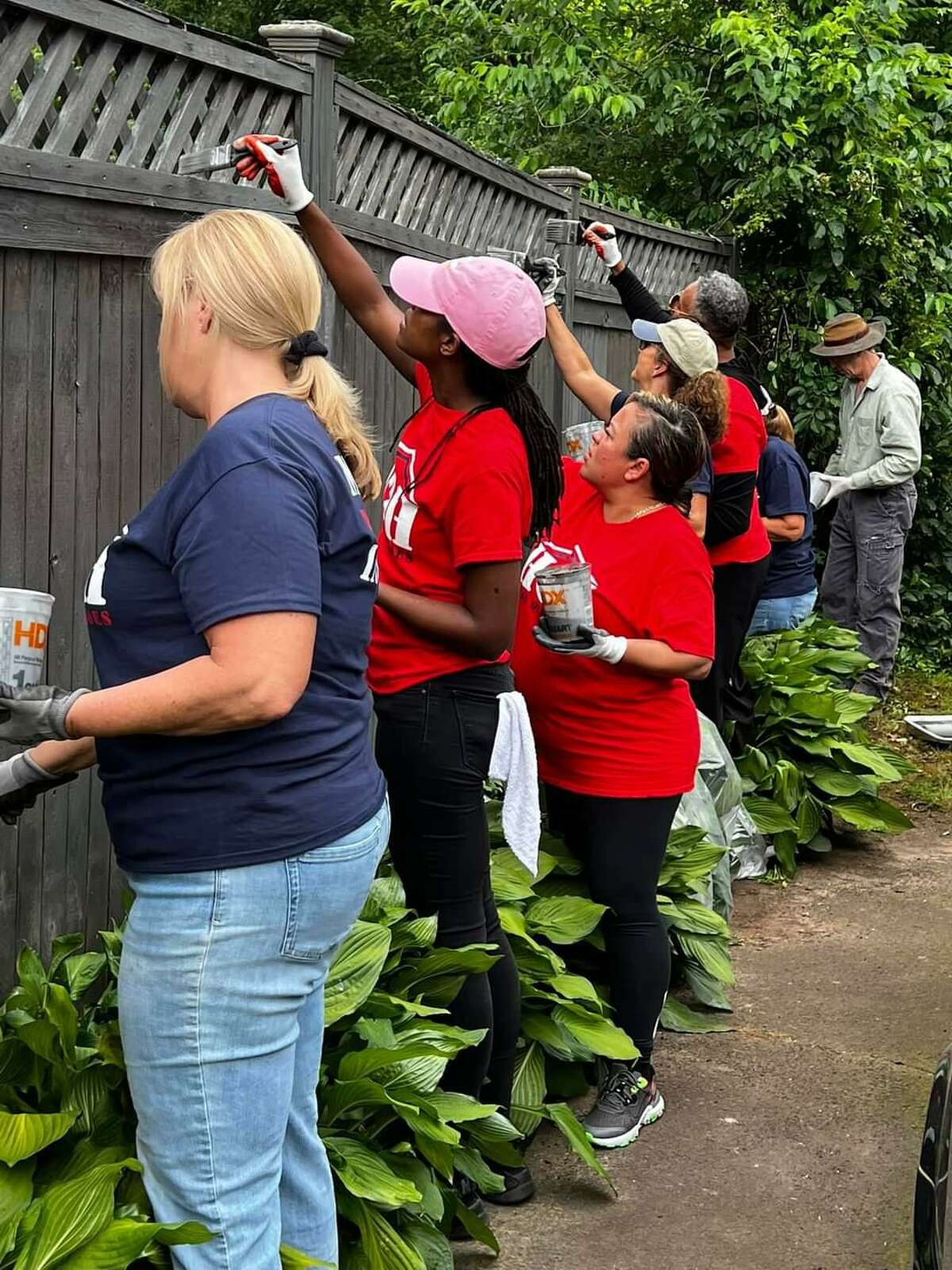 Volunteers work on the home of a North Haven veteran in June, marking House of Heroes Connecticut’s 173rd project.