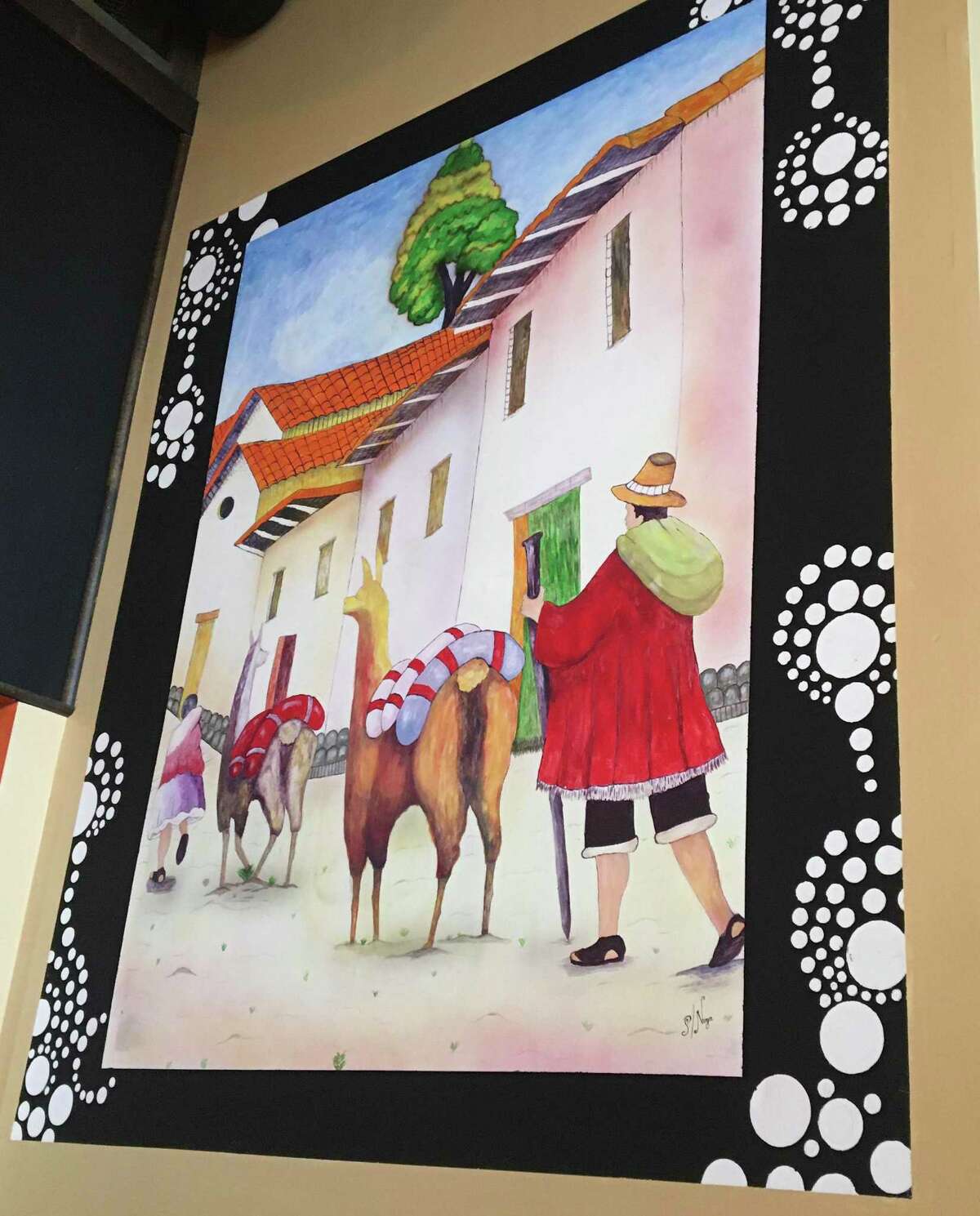 A painting of a scene from a village in the mountains outside of Cusco, Peru on the wall of Chacra Peruvian Cuisine & Pisco Bar, which will open in July 2022 at 152 Temple St. in downtown New Haven. The painting is by Pablo Nugra, an Ecuadorian artist who is the brother-in-law of Chacra owner Walter Vera.