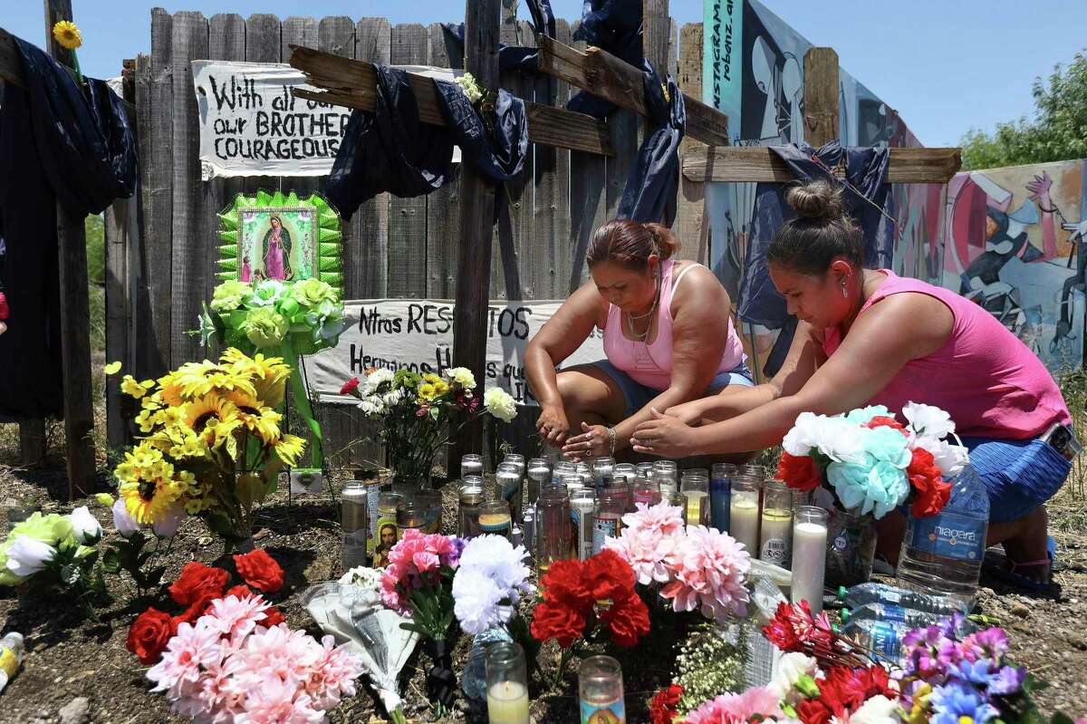 The memorial site remembering the 53 migrants who died is decorated with flowers, candles and crosses — but also with bottles of water symbolizing how they lacked hydration or cooling.