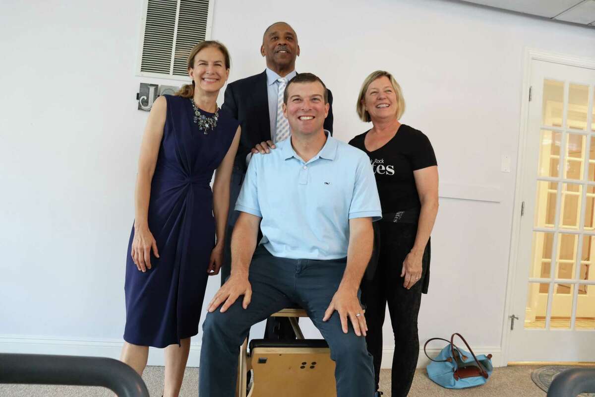 Lt. Governor Susan Bysiewicz, Executive Vice President, Director of Business Banking at Webster Bank, John Guy, State Rep. Steven Stafstrom visited Black Rock Pilates Studio owner Laura Pennock on Tuesday, June 28 2022 in Bridgeport, Conn.