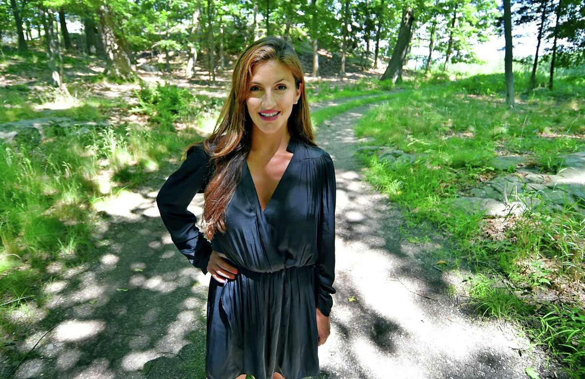 Jennifer Leahy, a real estate agent who sold Great Island to the town, poses during a tour of the land in Darien, Conn., on Thursday June 29, 2022.