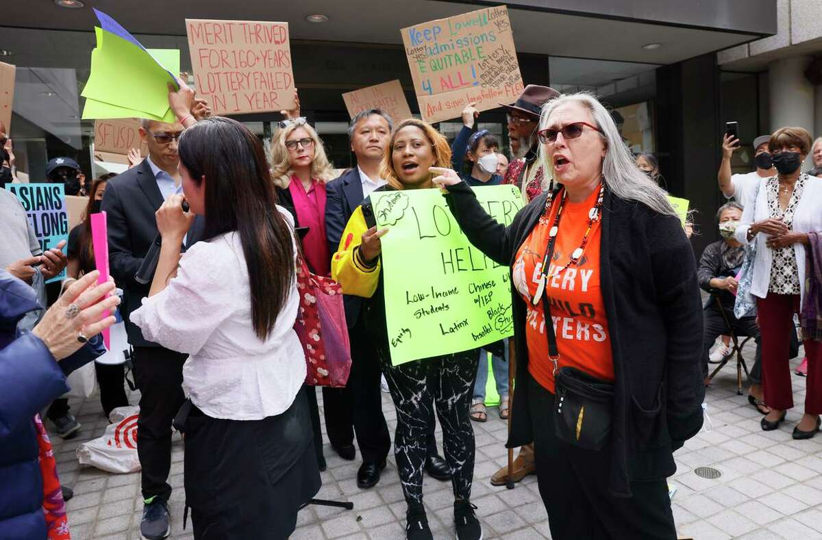 Protesters and supporters rally before the San Francisco Board of Education met and voted to restore Lowell High School’s selective admissions process.
