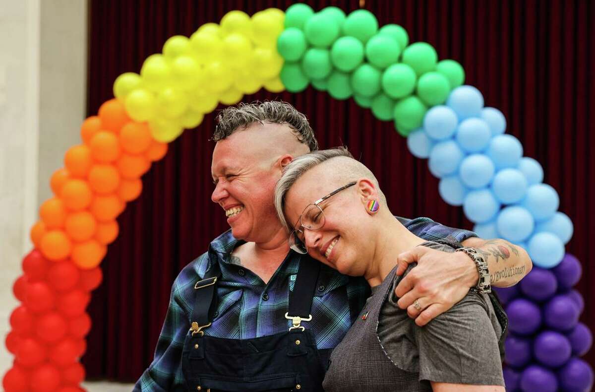 Jak Kazmarek (left) and wife Danni Fox moments after getting married at S.F. City Hall June 24.