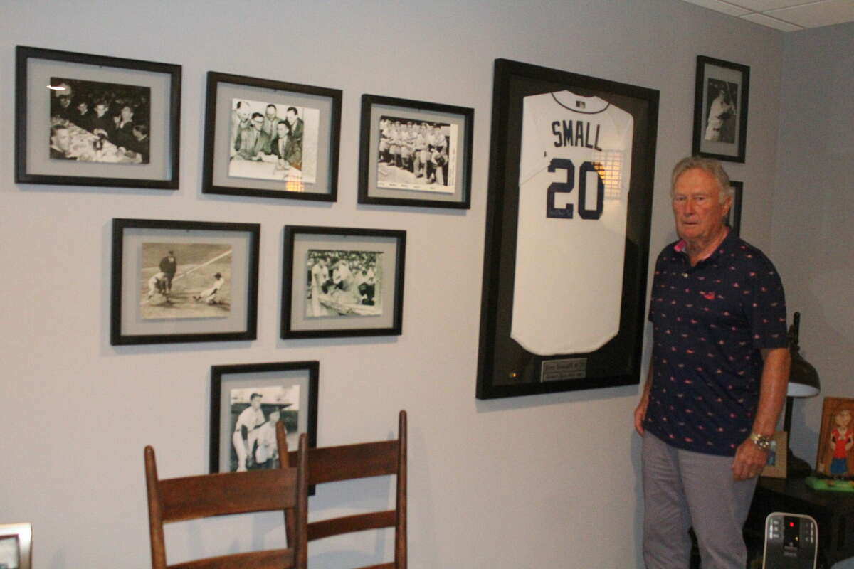 Jim Small stands in his basement at Canadian Lakes where he has hanging several pictures of his days with the Detroit Tigers.