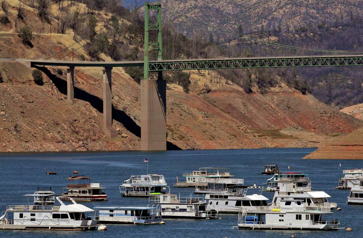 House boats float on Lake Oroville on June 28. The largest reservoir in the State Water Project this week stood at just 55% of where it normally is at this time of year.